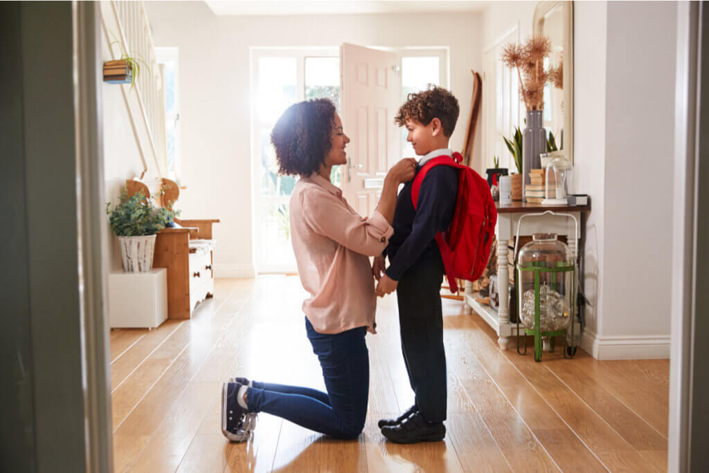 A mother looks into the eyes of a child who's starting school.