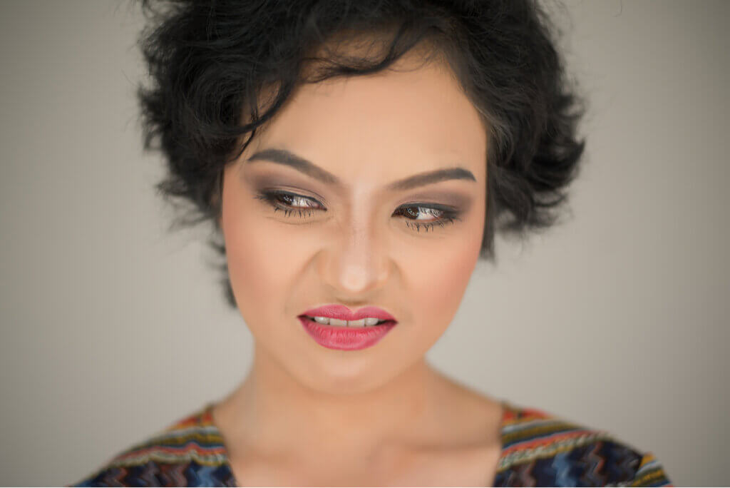 A woman showing contempt on her face.