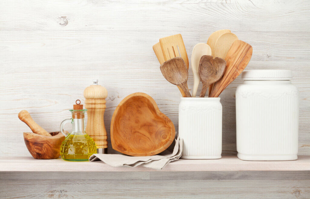 Cooking utensils and a bottle of olive oil.
