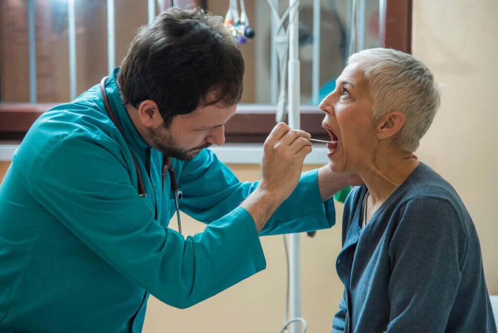 Laryngitis attended by a doctor in an adult.