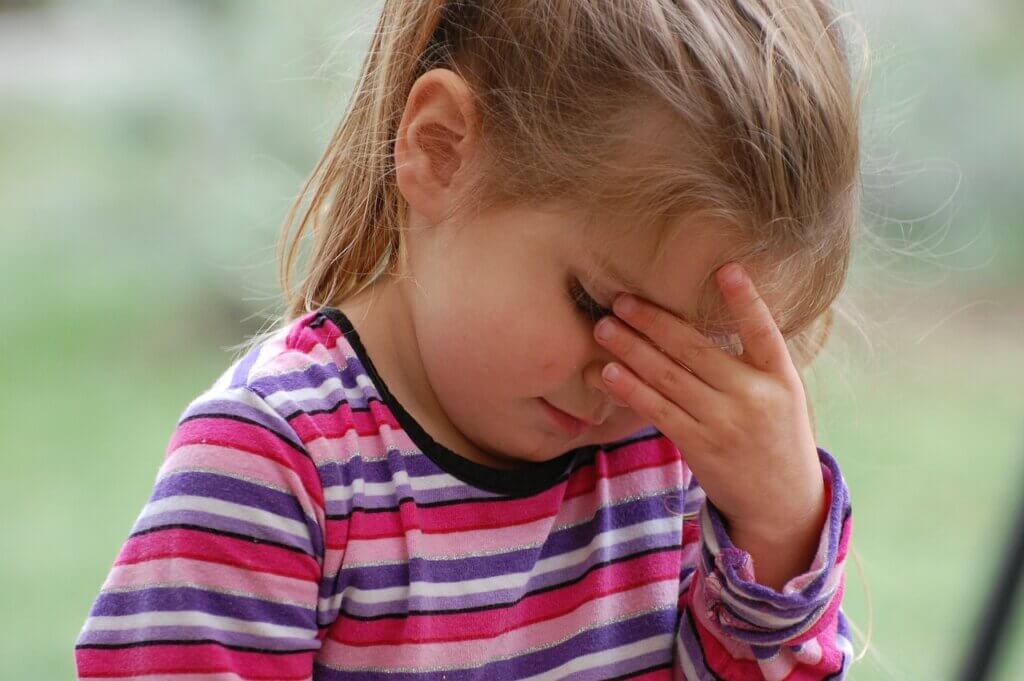 Girl with headache.