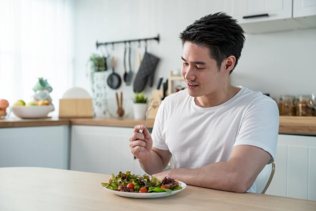 A man eating a salad.