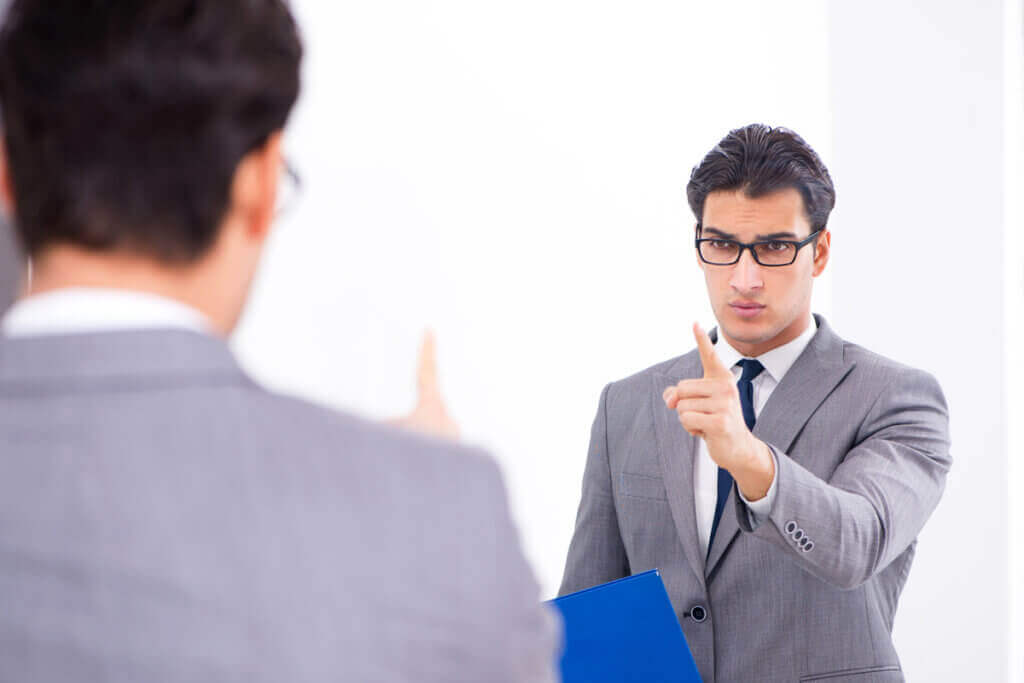 A man talking to his own reflection.